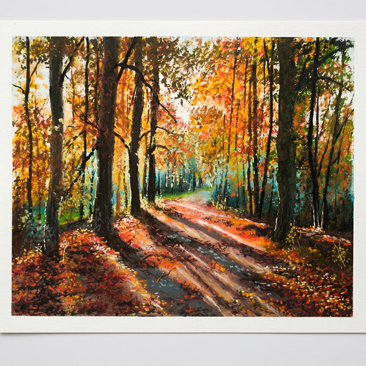 Handcrafted original oil pastel landscape painting of a peaceful autumn forest path illuminated by warm golden sunlight, featuring rich fall colors, A5 size 5.8x8.3 inches.