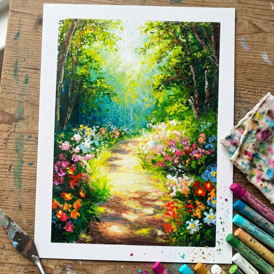 Handcrafted oil pastel painting of a sunlit woodland path lined with vibrant colorful wildflowers leading into a green forest.